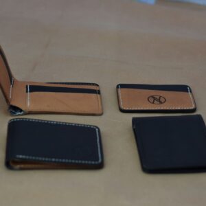Black leather wallet with card holders and RFID protection on a table