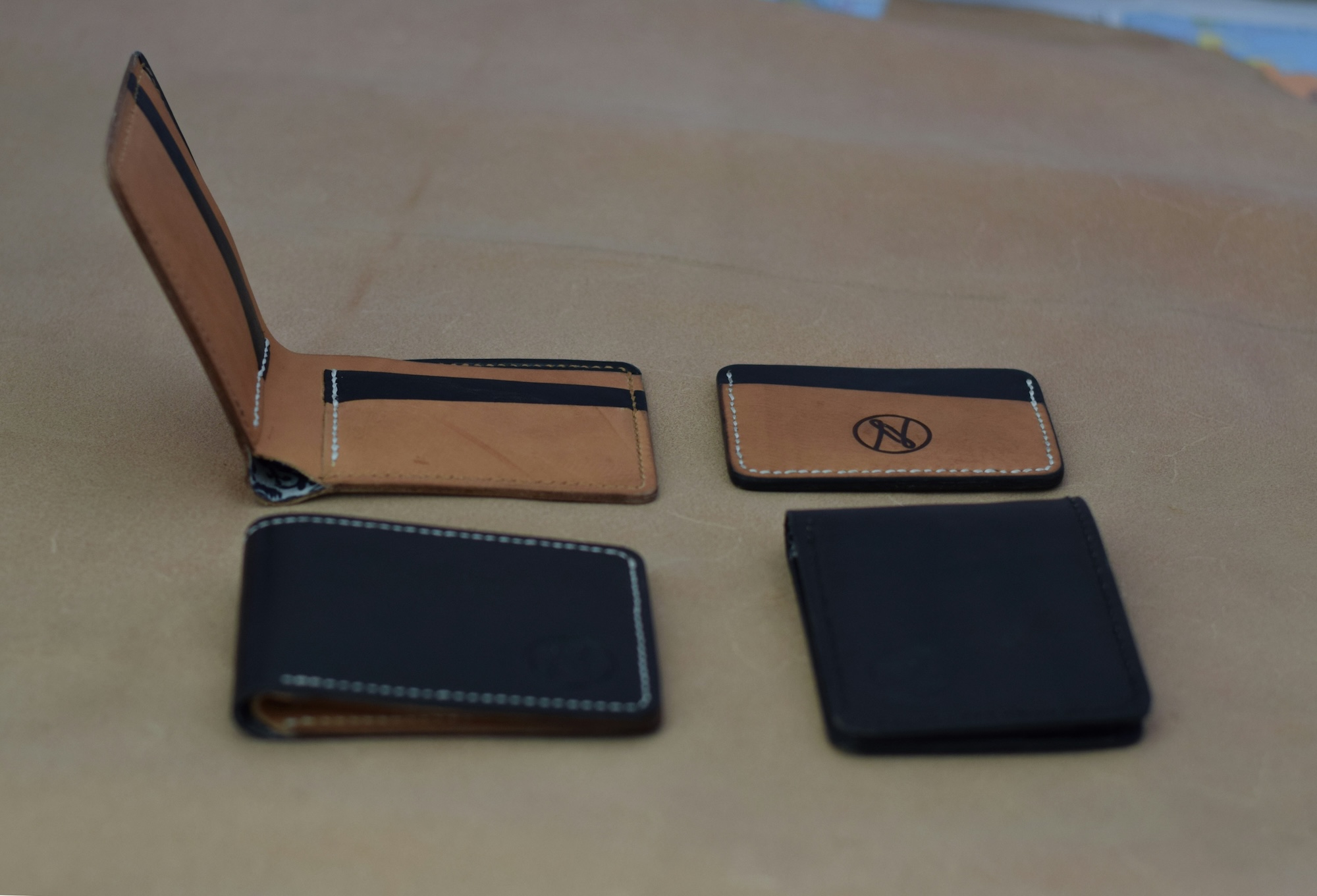 Black leather wallet with card holders and RFID protection on a table
